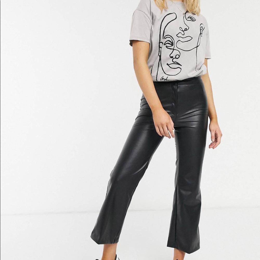Cropped kick flare faux leather pants.